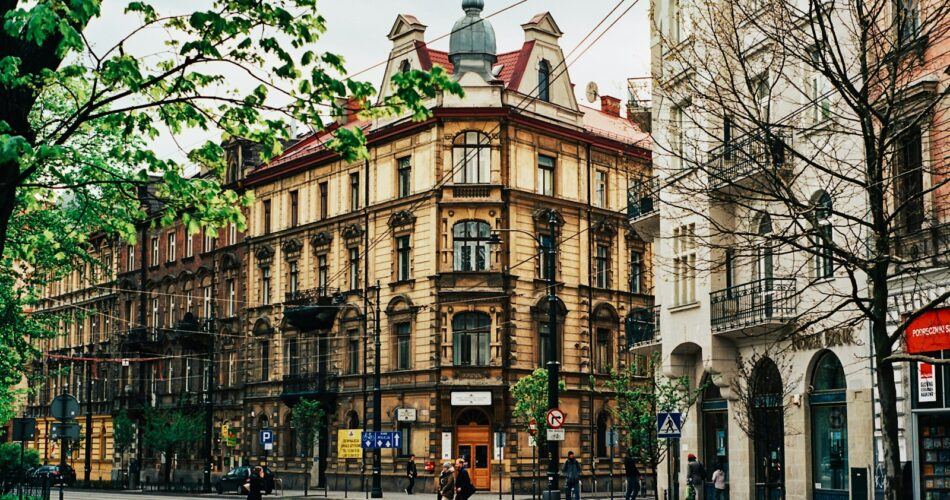 people walking near beige building